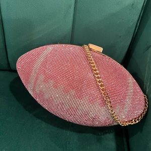 Pink football clutch with gold chain